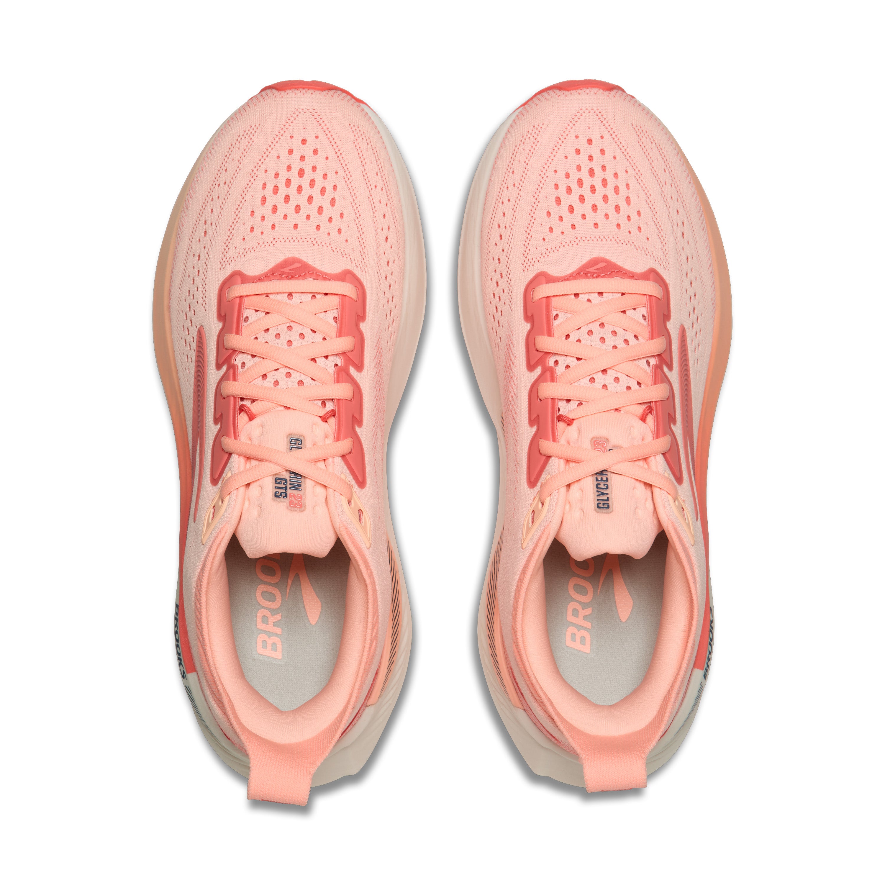 Pair of pink running shoes on a white background