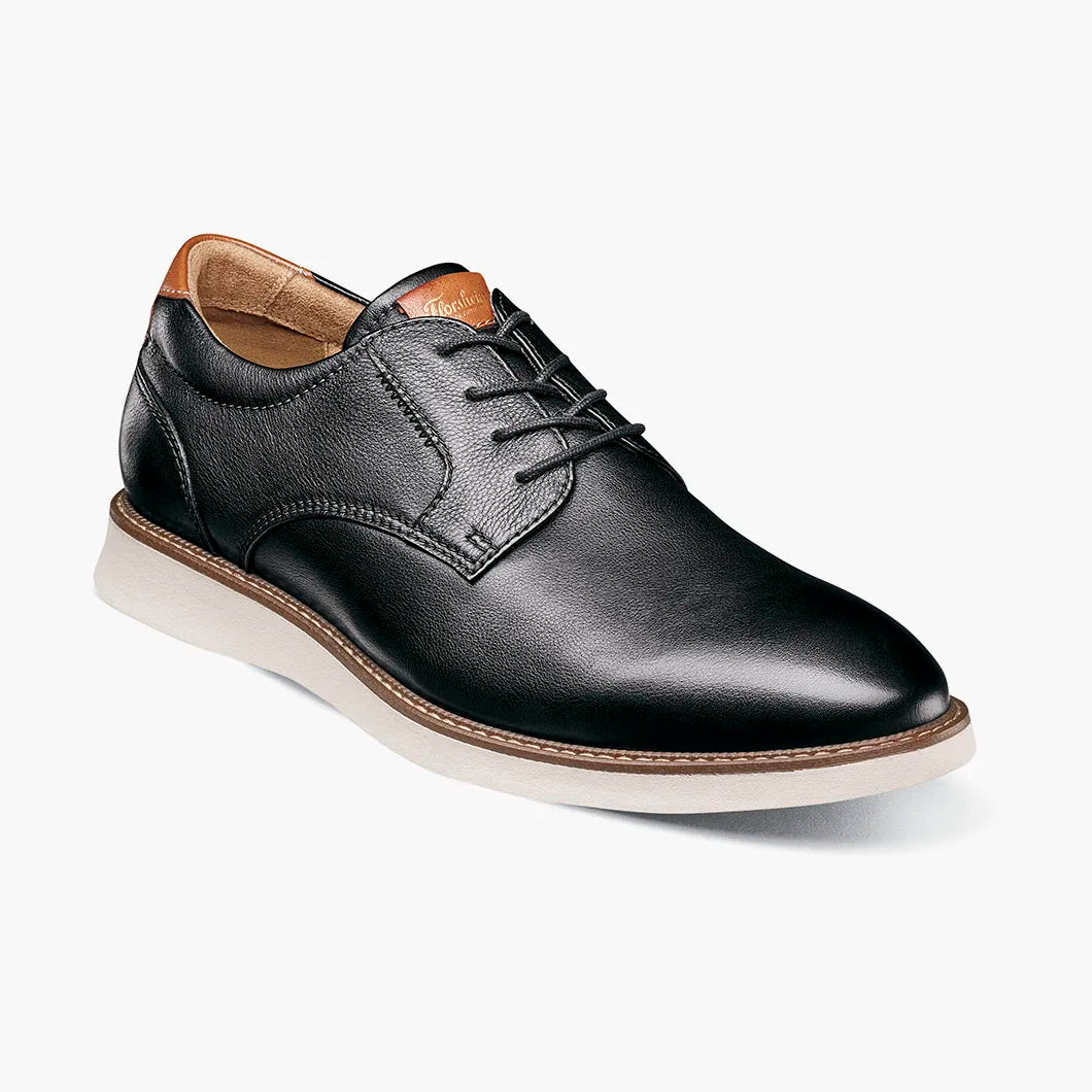 Brown leather shoe on a white background
