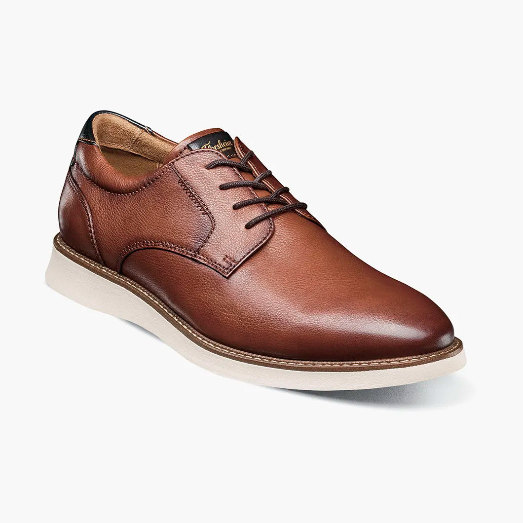 Brown leather shoe on a white background