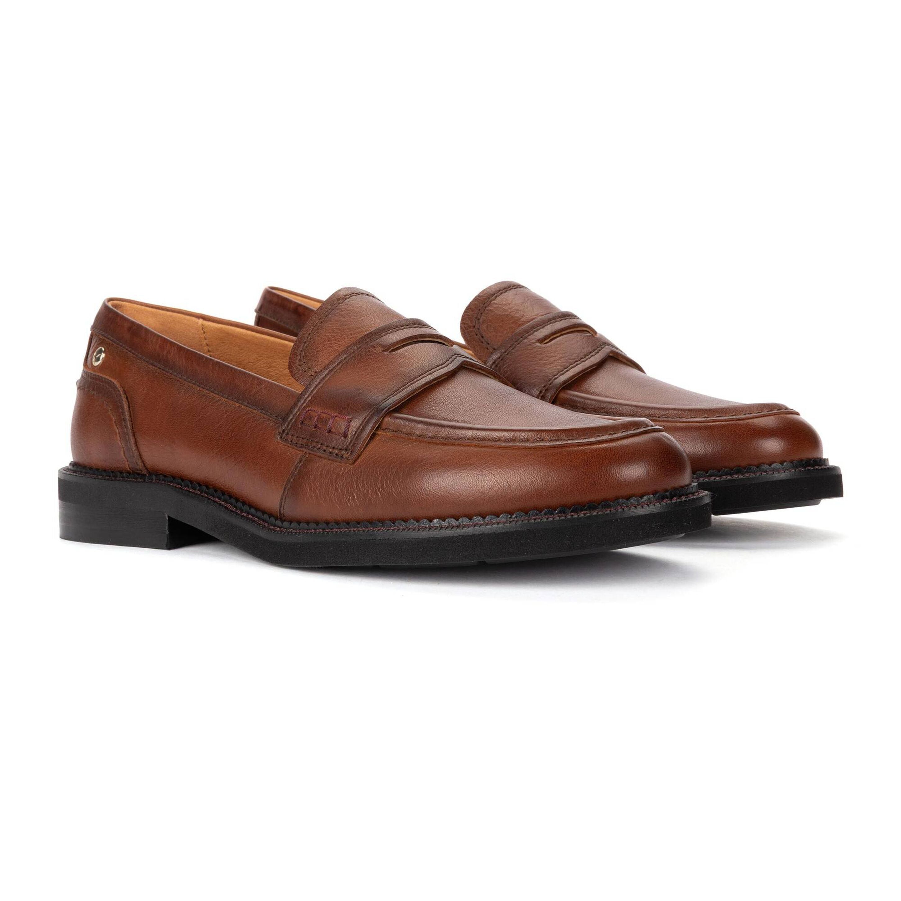 A pair of brown leather penny loafers with black soles, displayed on a clean white background.