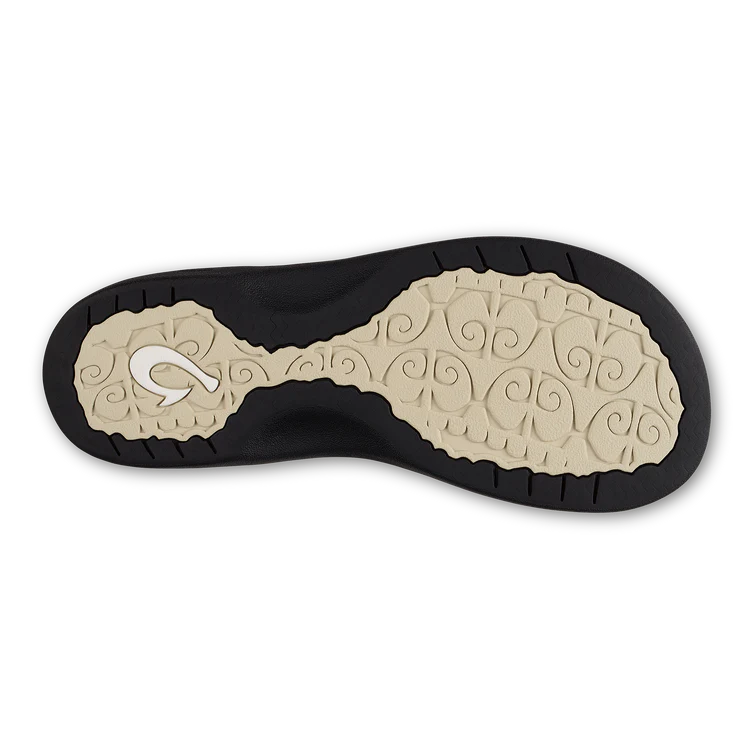 Close-up of a shoe sole with a brand logo on a white background