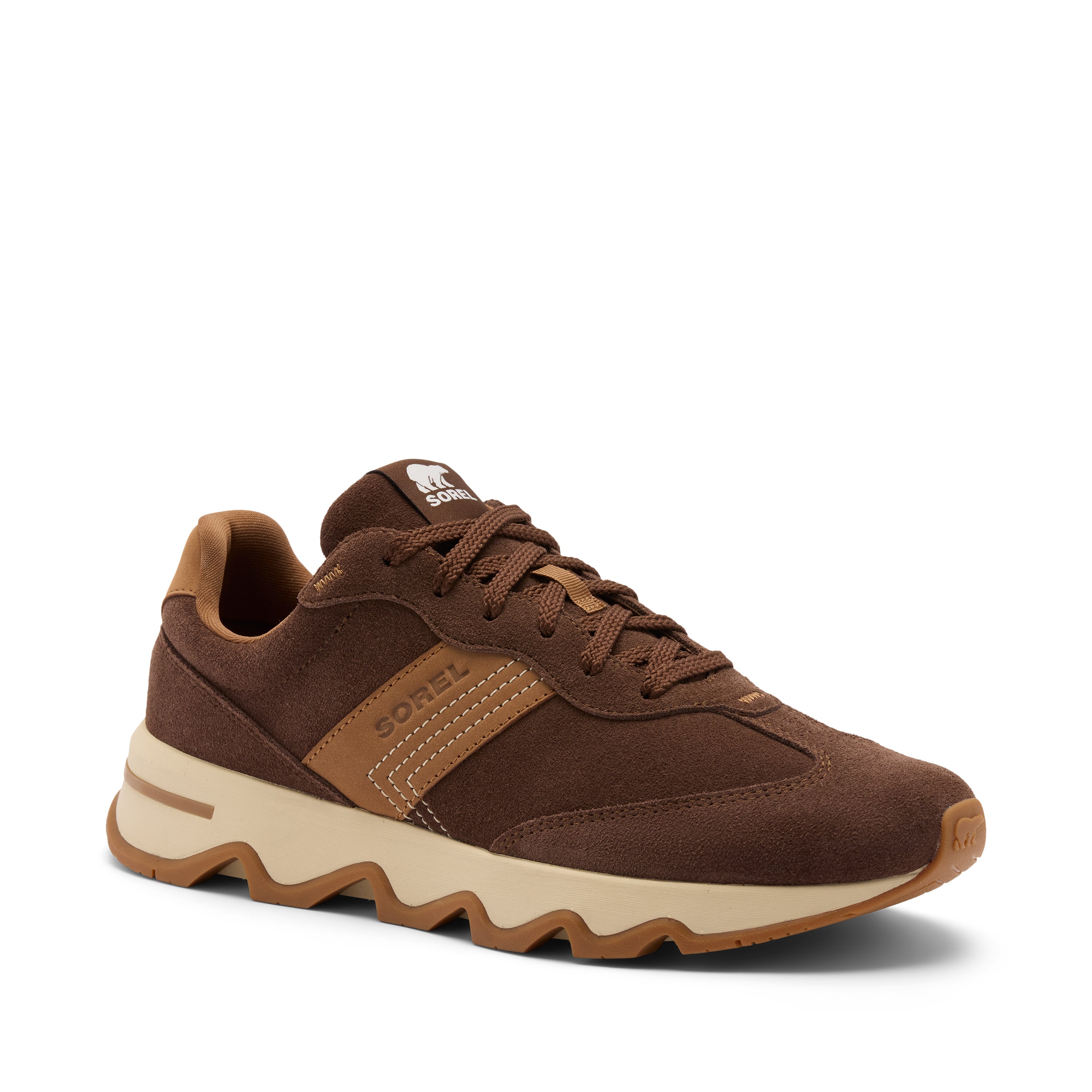 A brown suede and mesh athletic sneaker with a beige midsole and a brown wavy lug outsole, shown from a three-quarters angle on a white background.