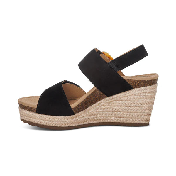 Black wedge sandal with espadrille sole on a white background