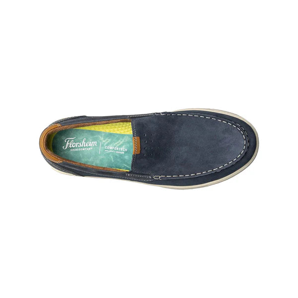 Navy blue loafer shoe with brand label on a white background