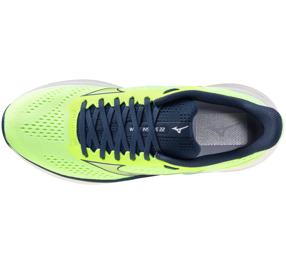 Neon green and navy running shoe on a white background
