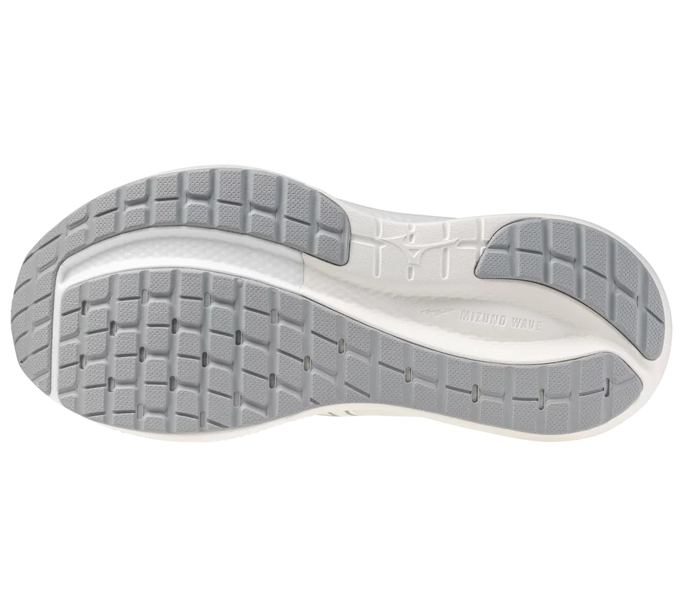 Close-up of a shoe sole with tread pattern on a white background