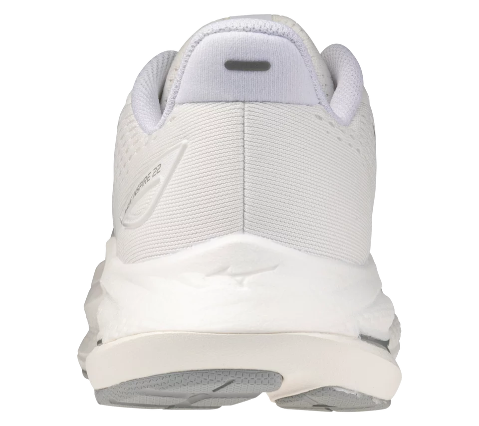 White athletic shoe with visible brand logo on a white background