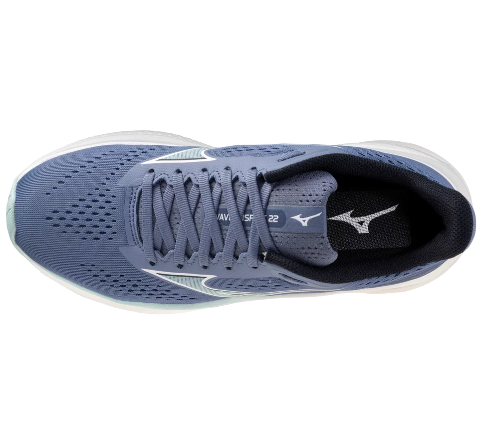 Blue running shoe with white laces on a white background