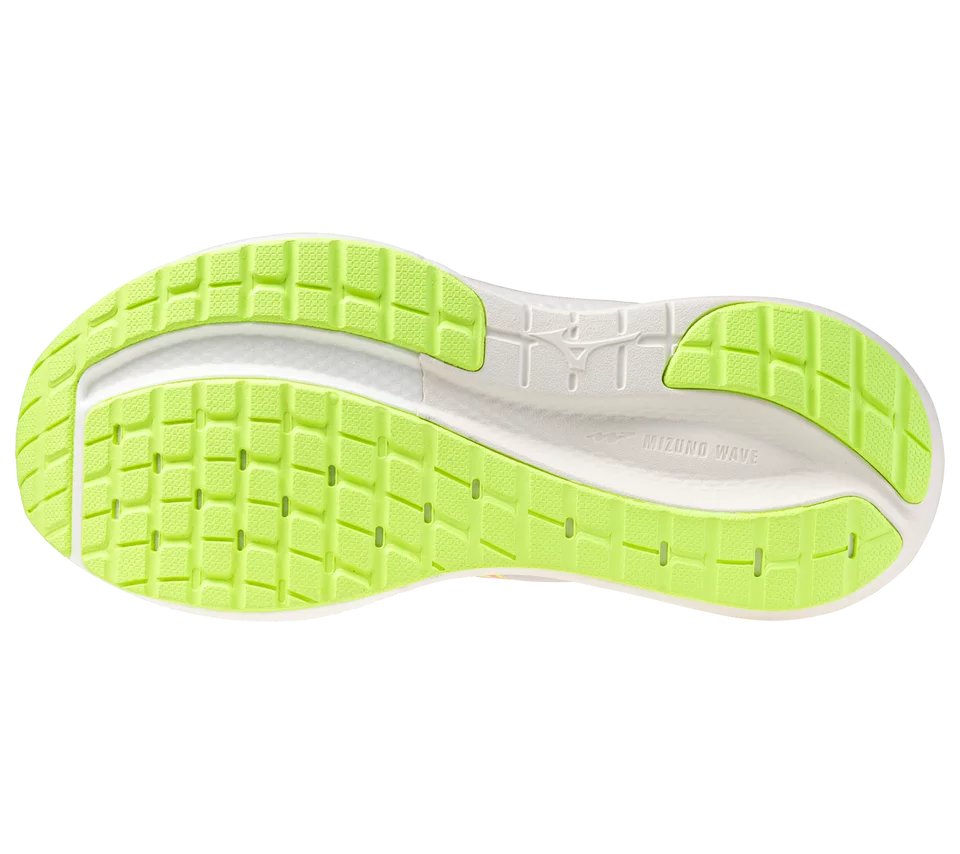 Close-up of a shoe sole with green and white design on a white background