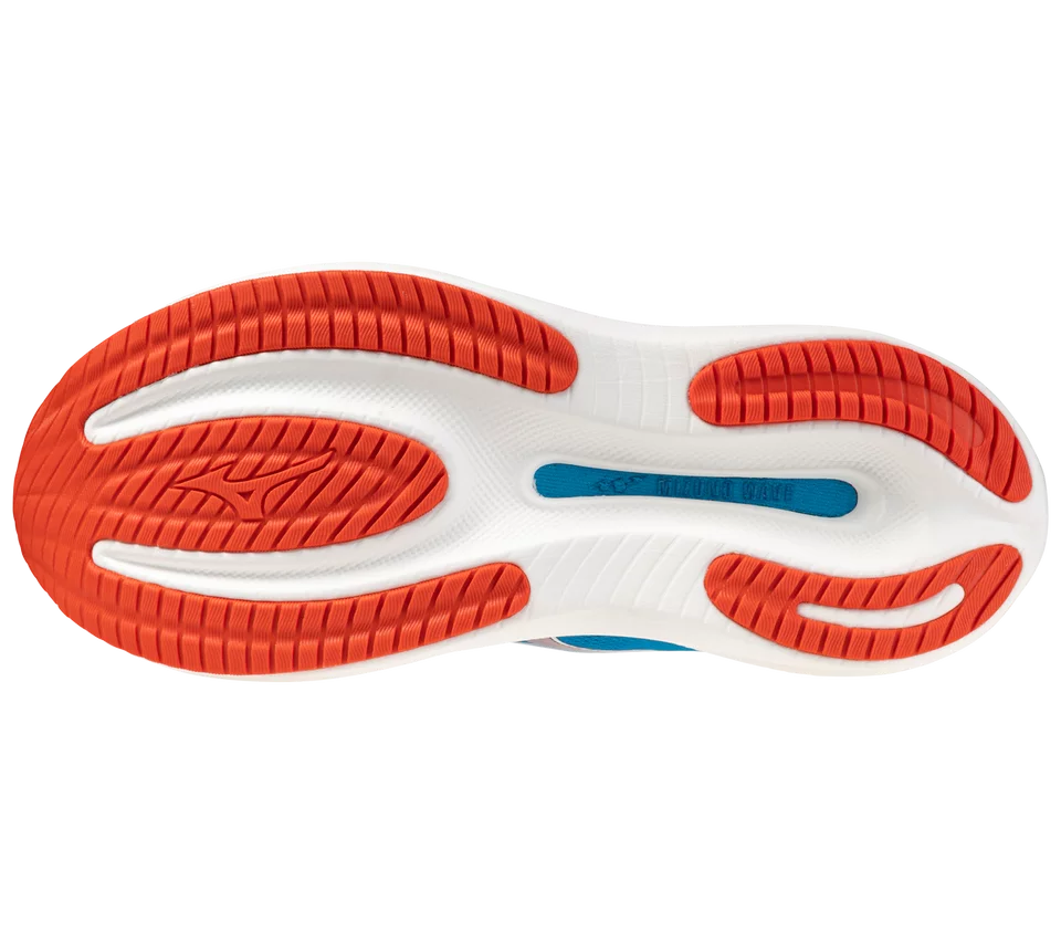 Close-up of a shoe sole with red and white design on a white background