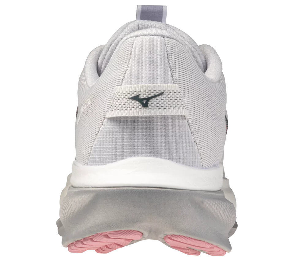 White running shoe with pink sole on a white background