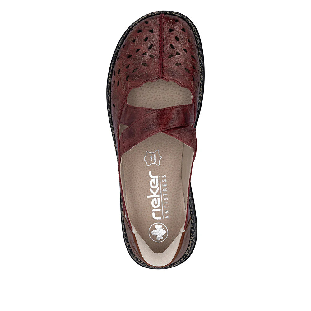 Brown sandal with perforated design on a white background