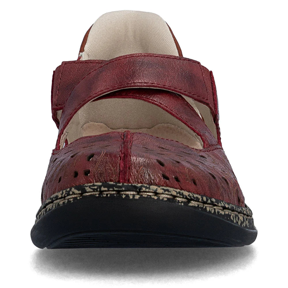 Red sandal with a patterned sole on a white background