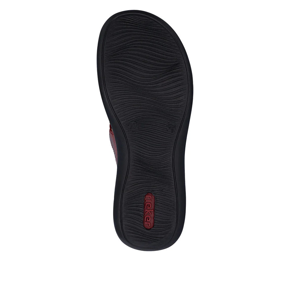 Black sandal sole with brand logo on a white background