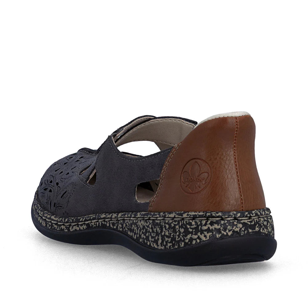 Navy sandal with brown heel and patterned sole on a white background