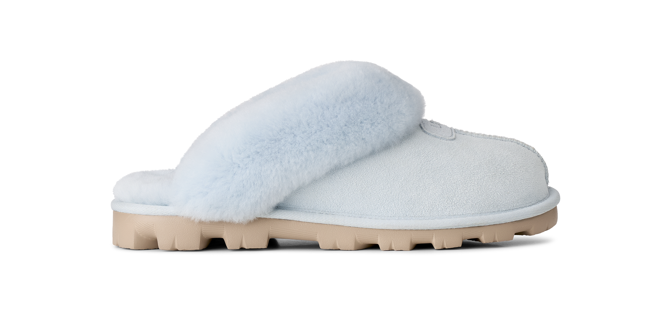 A single light blue slip-on slipper with fluffy faux-fur trim and a chunky beige sole, shown in profile against a solid white background.