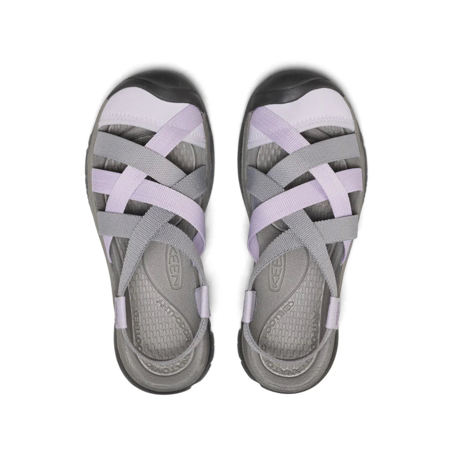 Pair of gray and purple sandals on a white background