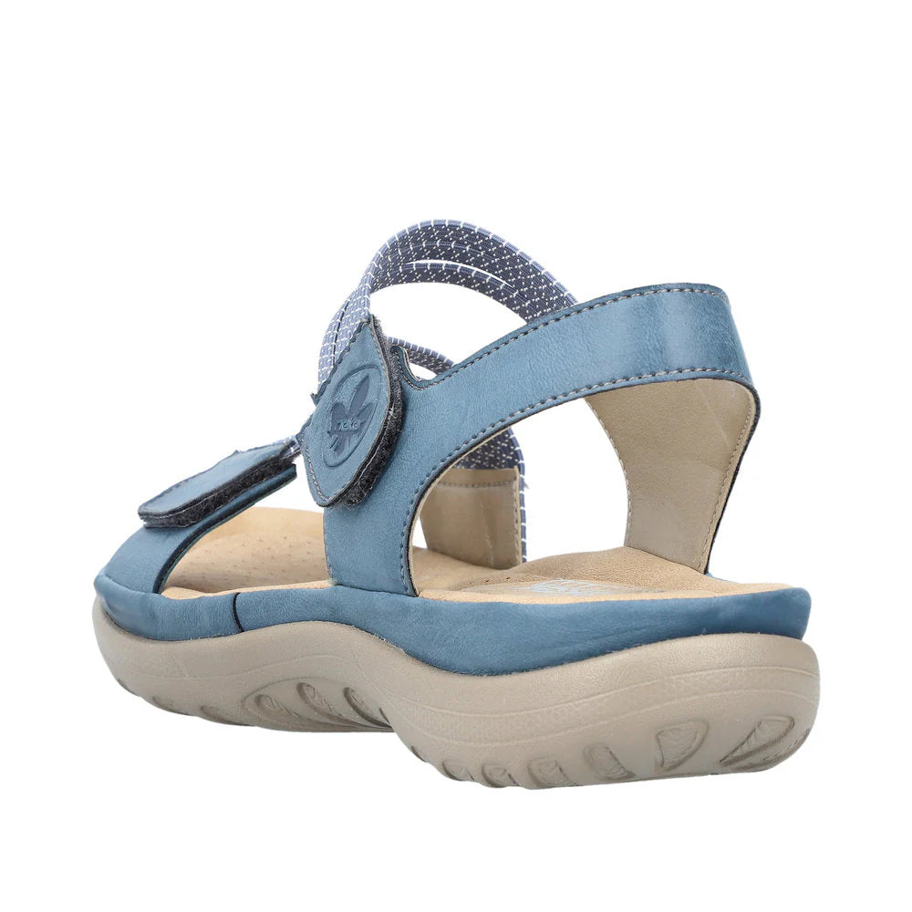 Blue sandal with a beige sole on a white background