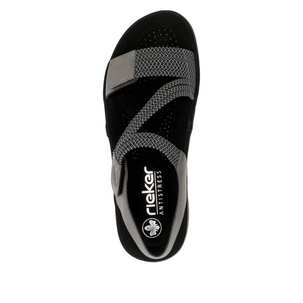 Black sandal with gray straps on a white background