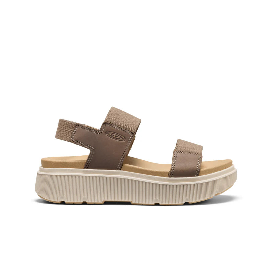 Brown sandal with platform sole on a white background