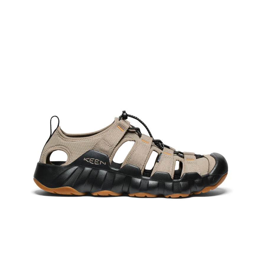 Beige and black sandal with 'Keen' branding on a white background