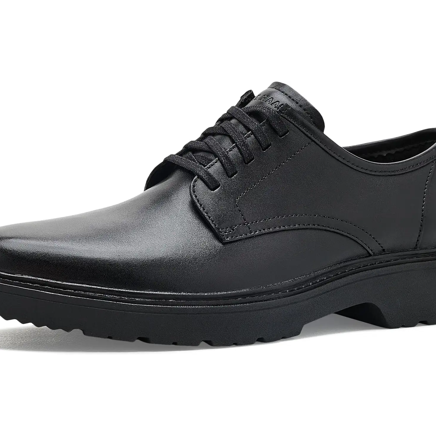 A single black leather lace-up dress shoe with a chunky black sole, shown from a side profile on a white background.