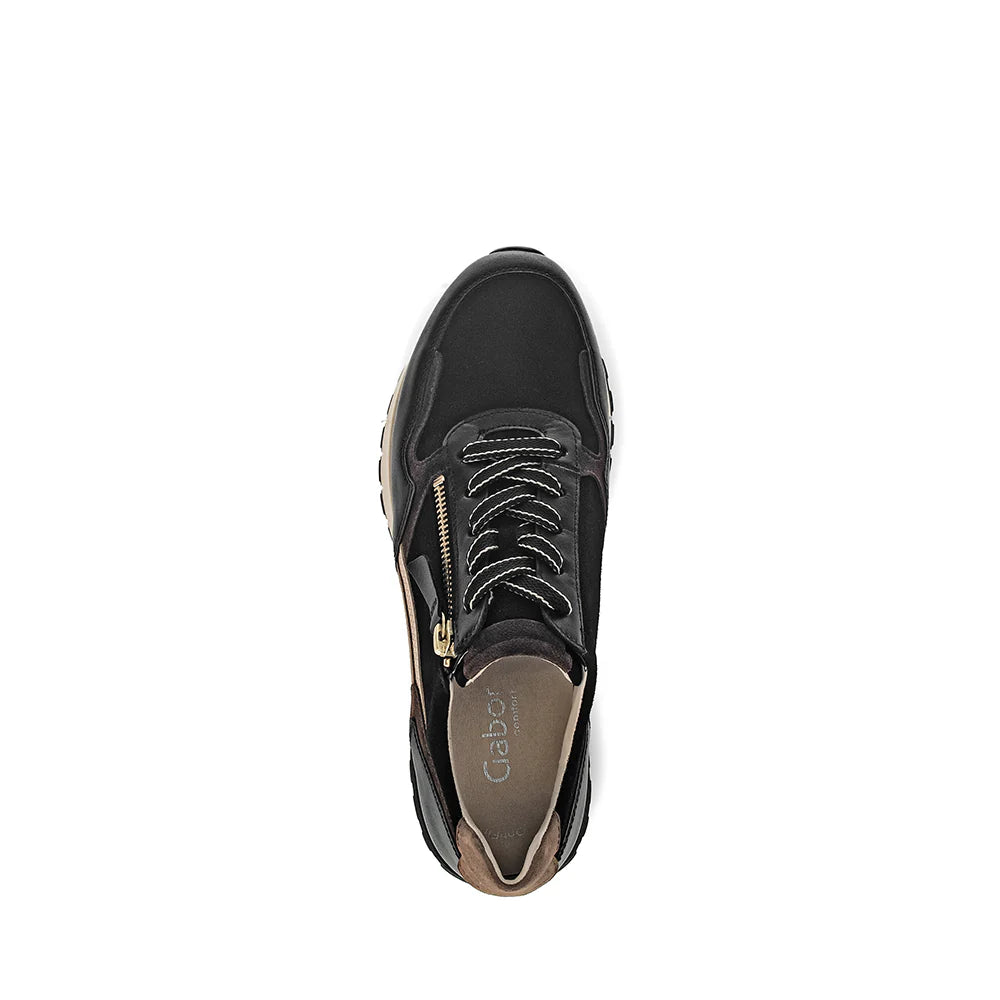 Black sneaker with a gold zipper on a white background