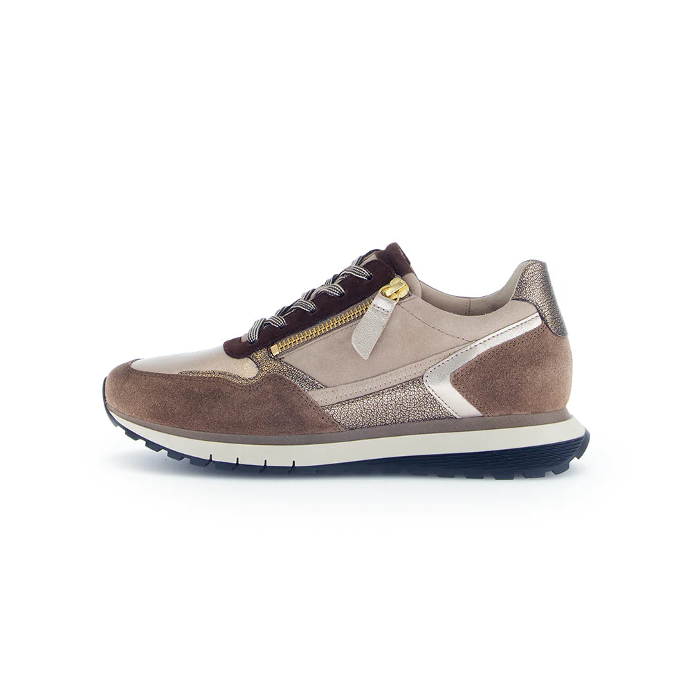 Brown and beige sneaker with a gold zipper on a white background