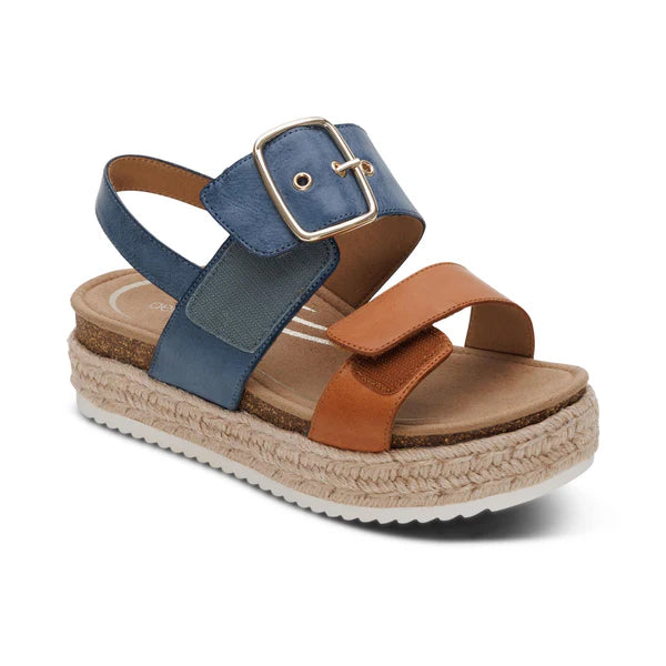 Blue and brown sandal with a buckle on a white background