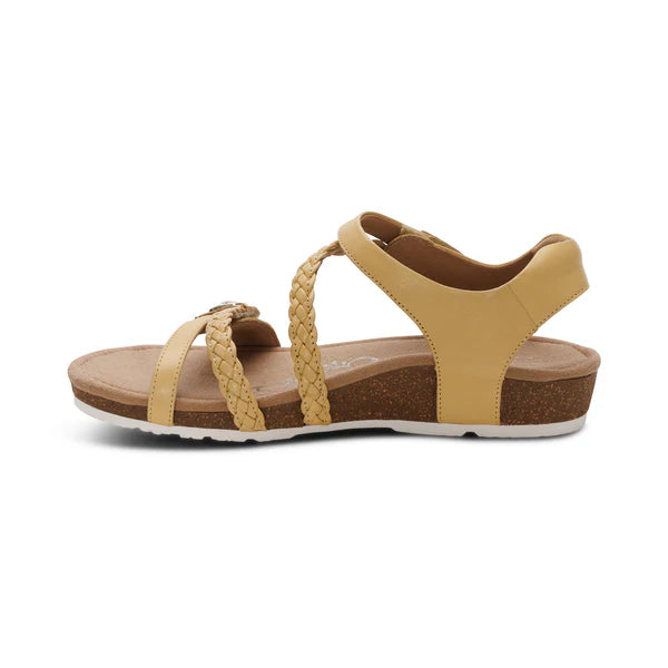 Beige sandal with braided straps on a white background