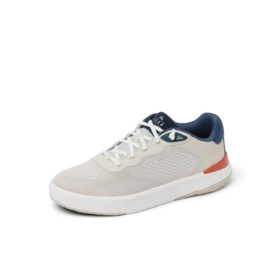 White sneaker with gray sole on a white background