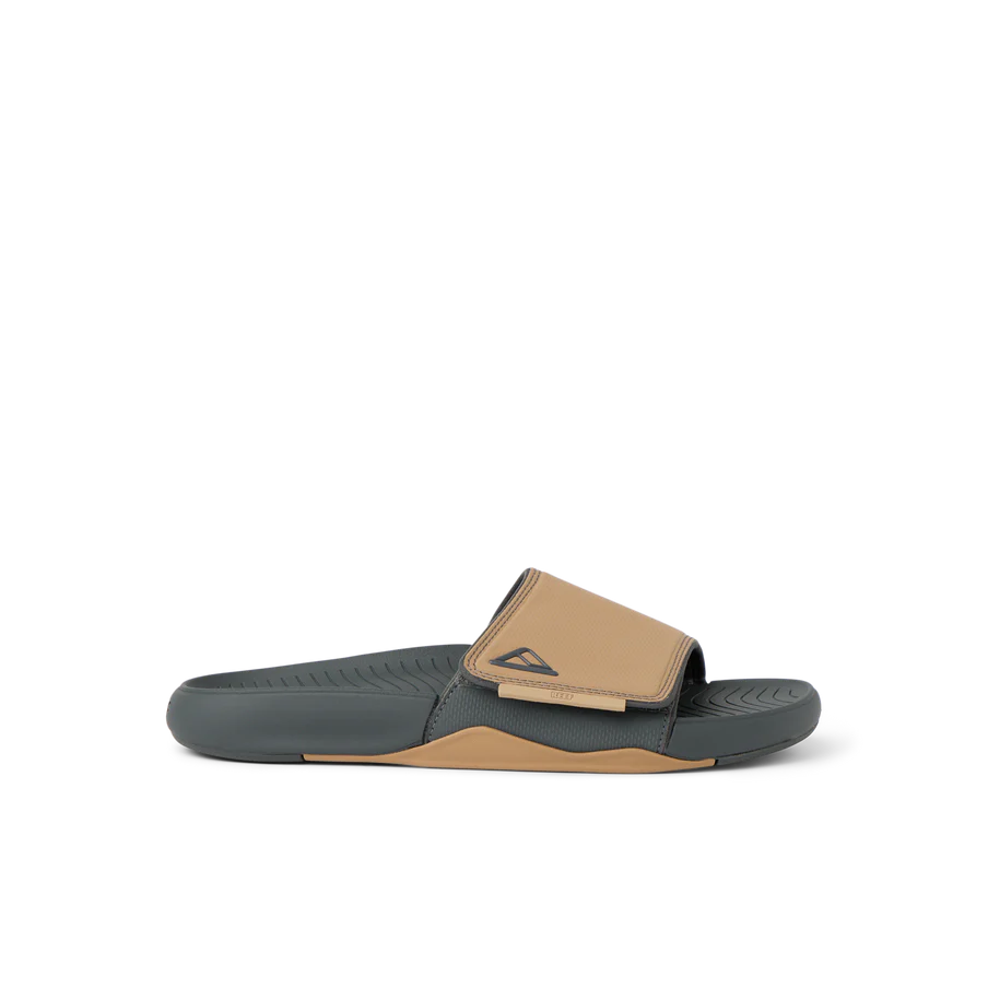 Brown and black slide sandal on a white background