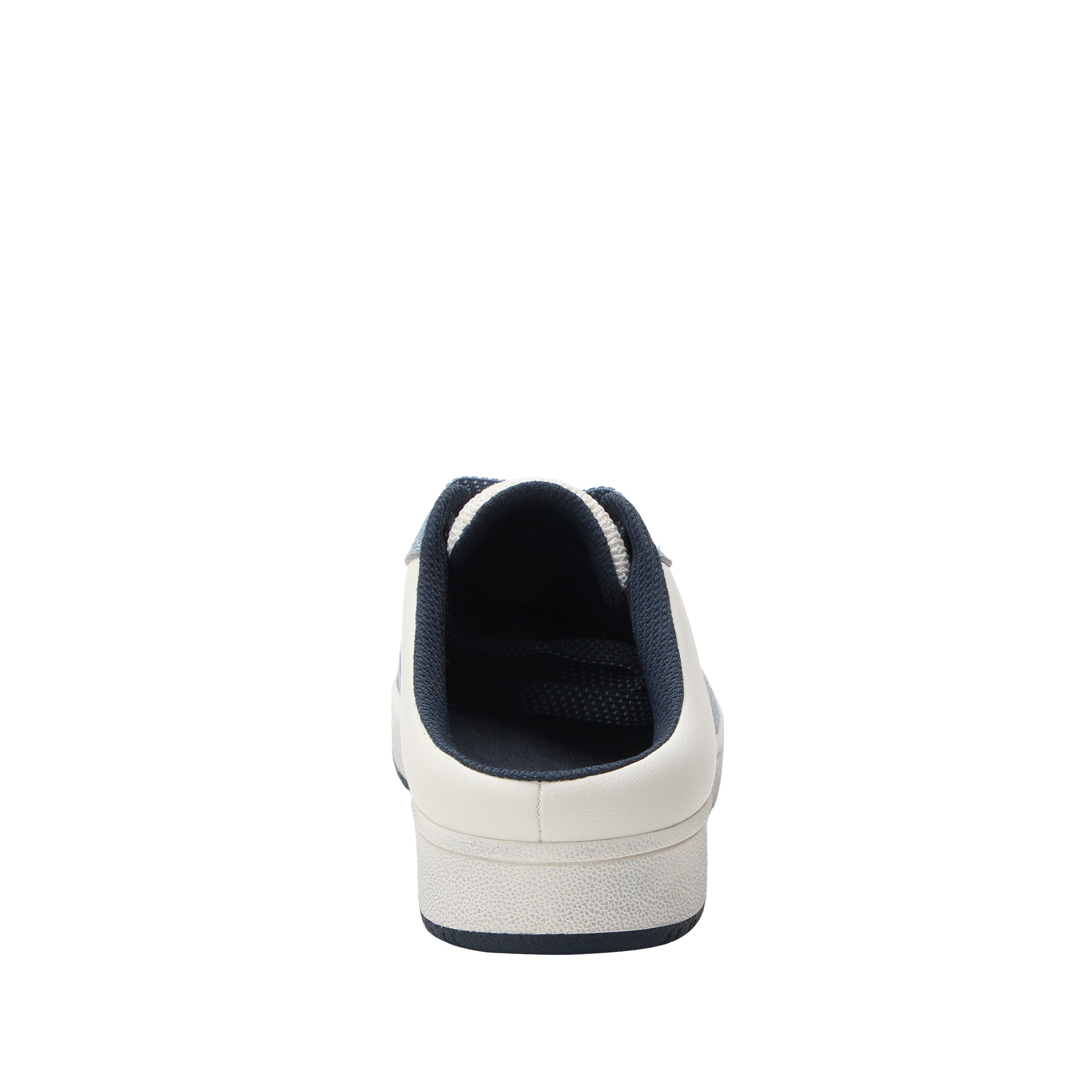White sneaker with black sole on a white background