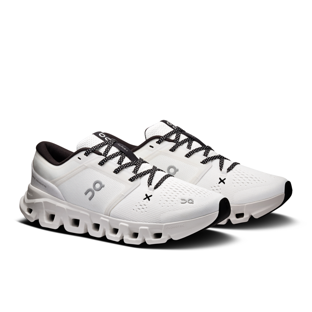 White running shoes with black laces on a white background