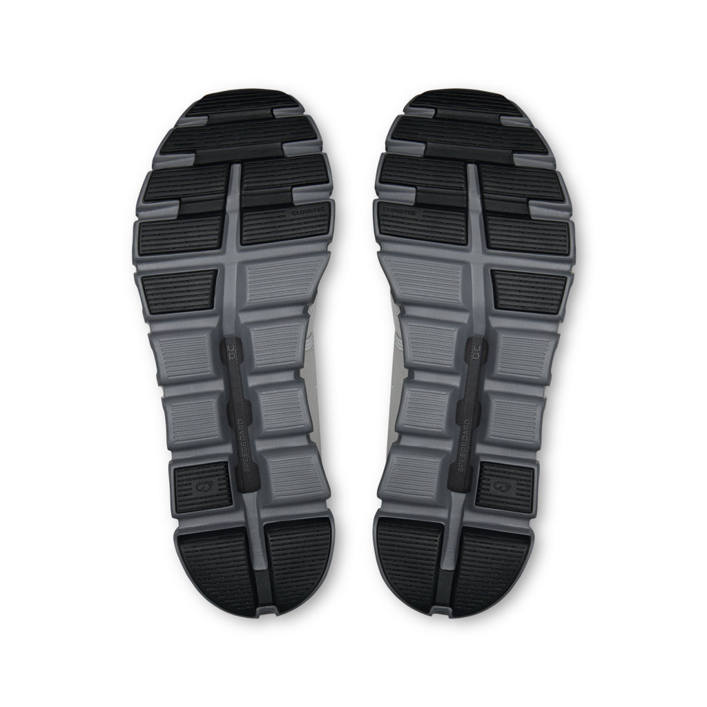 Top view of a pair of black and gray athletic shoes on a white background