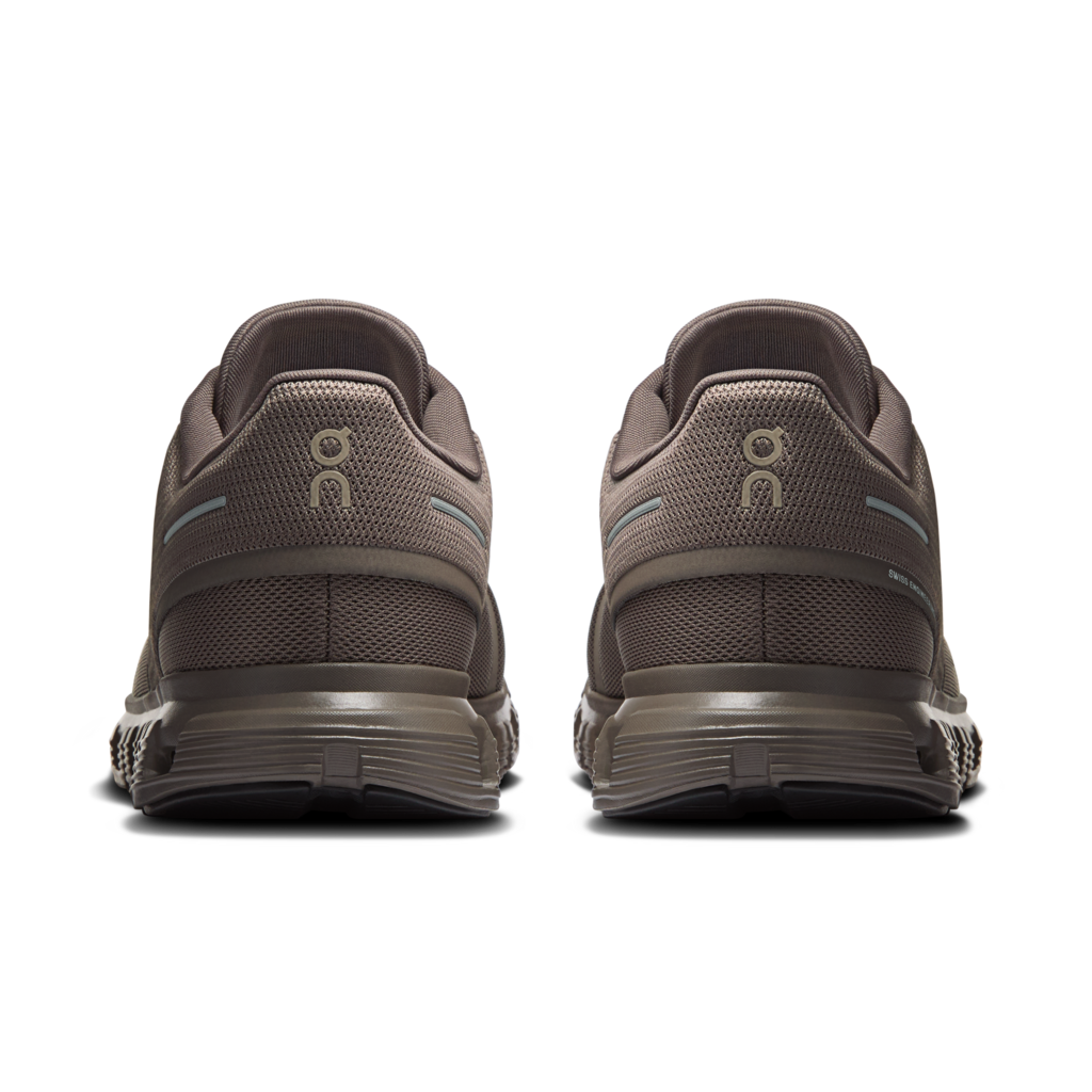Brown athletic shoes shown from the back on a white background