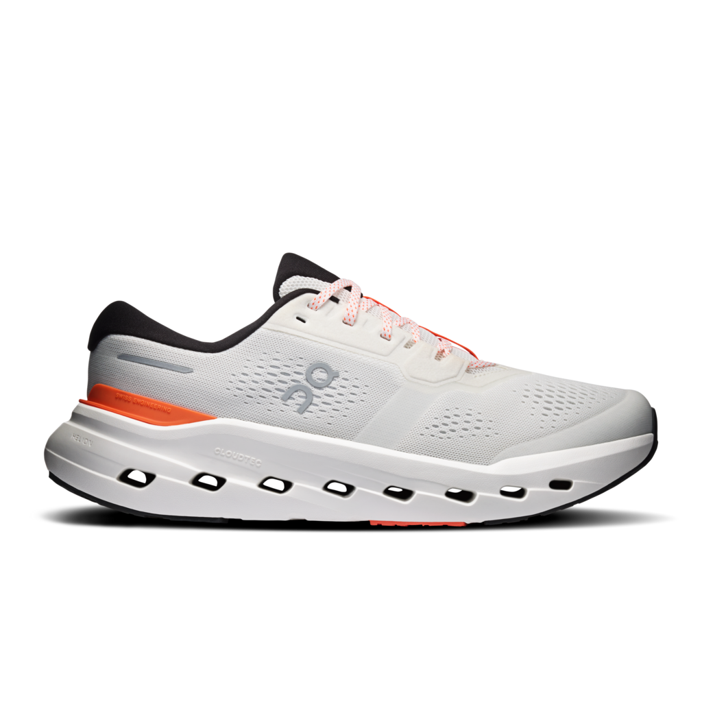White athletic shoe with black and orange accents on a white background