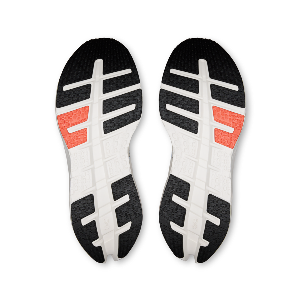 Pair of black, white, and red shoe insoles on a white background