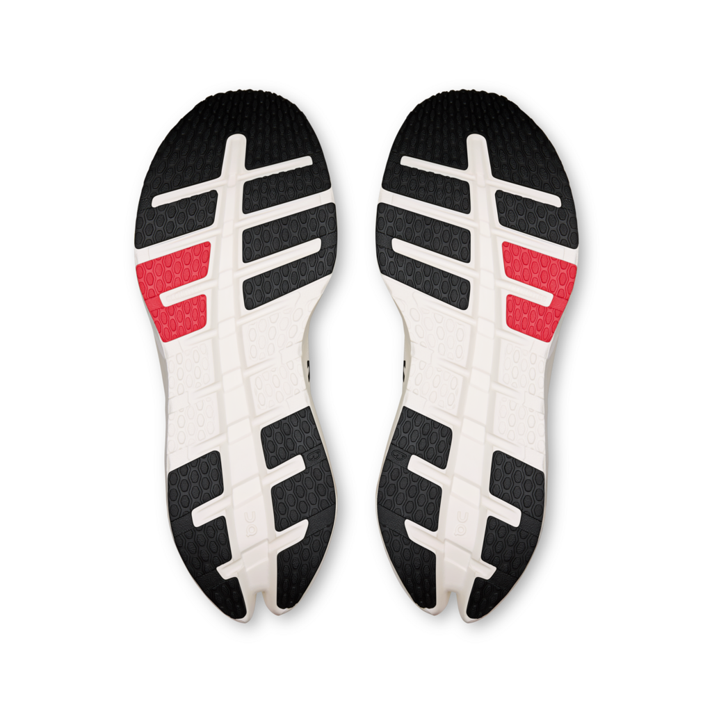 Pair of shoe insoles with black, white, and red design on a white background
