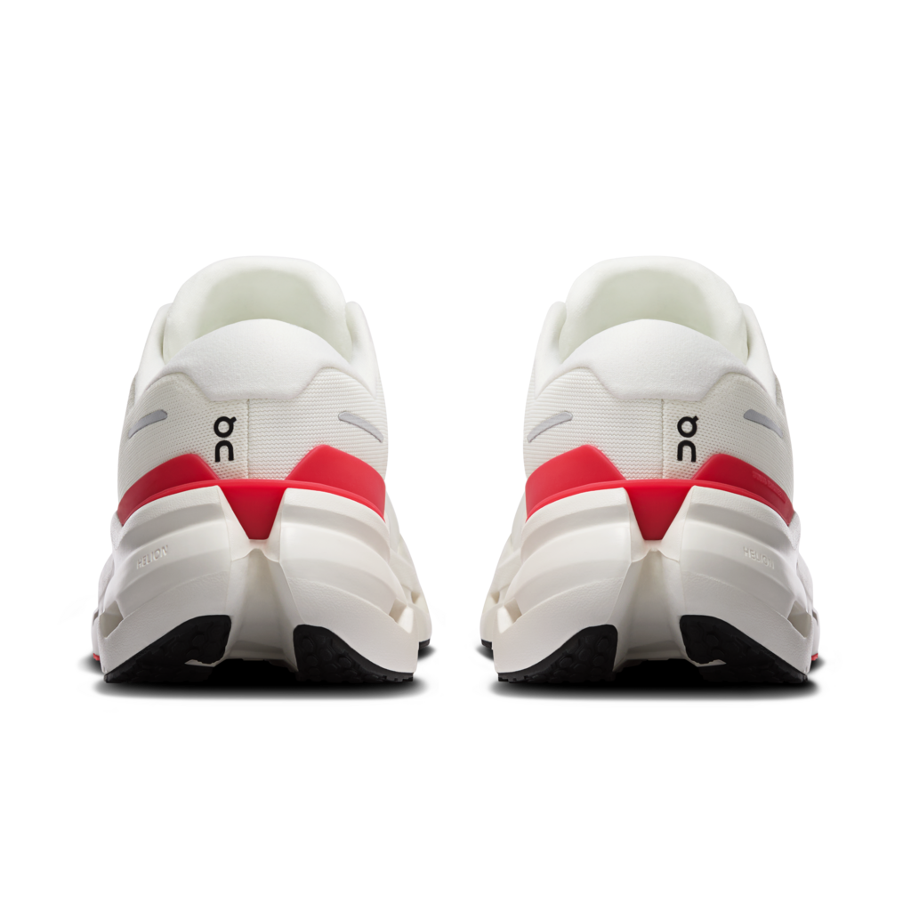 White running shoes with red accents on a white background