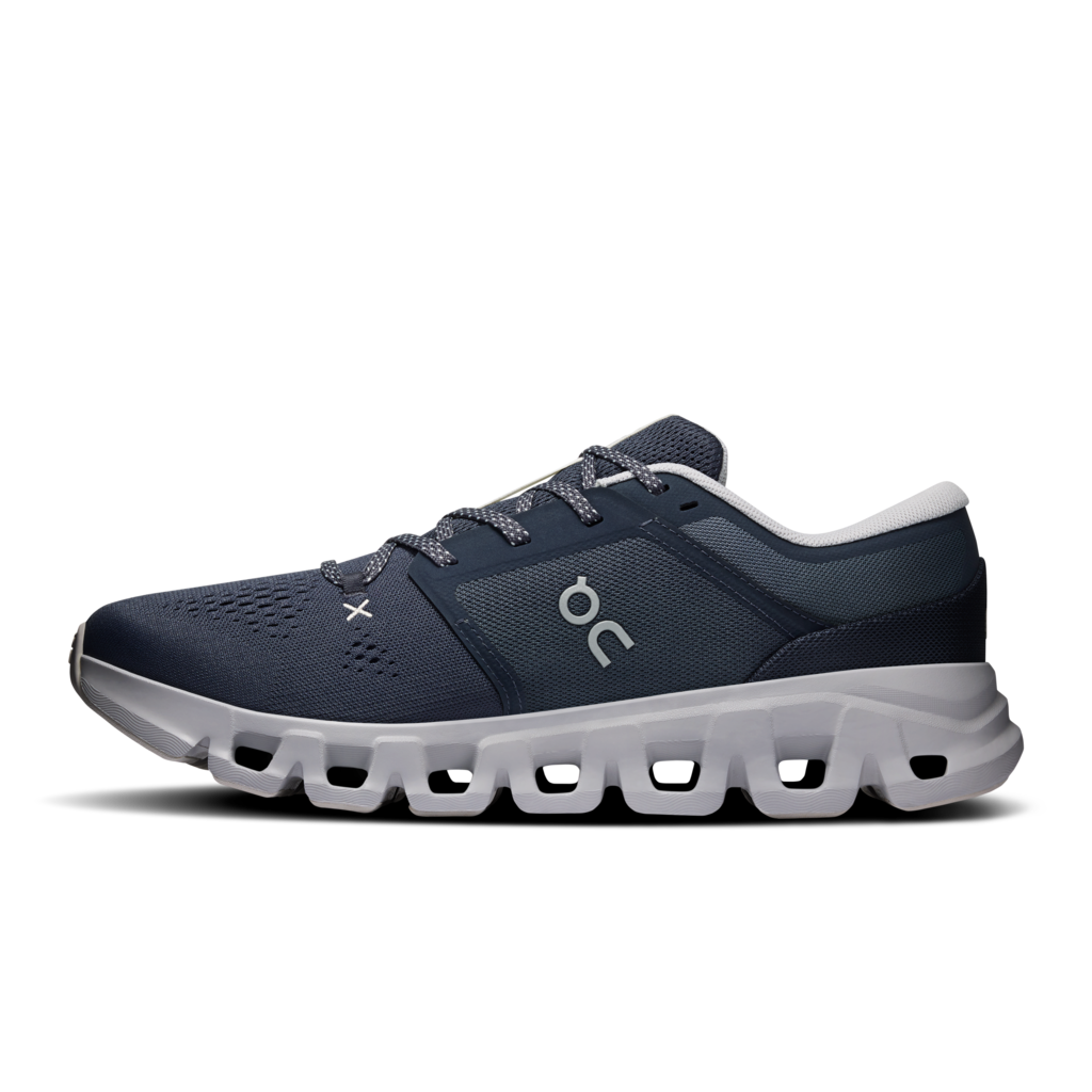 A dark navy blue On running shoe with a chunky light gray sole, shown in a side profile on a white background.