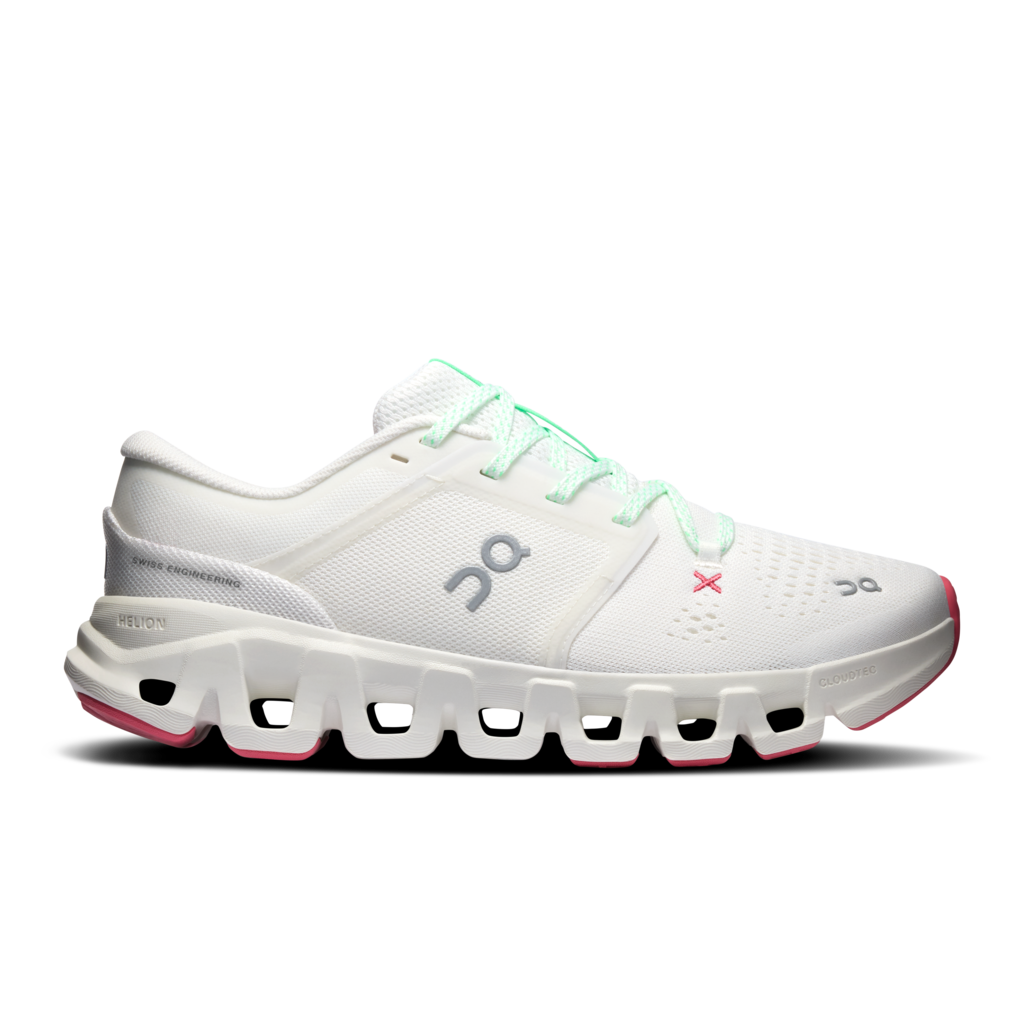A white On running shoe with mint green laces, a gray On logo, a small pink X logo, and pink accents on the midsole and toe cap, shown against a plain white background.