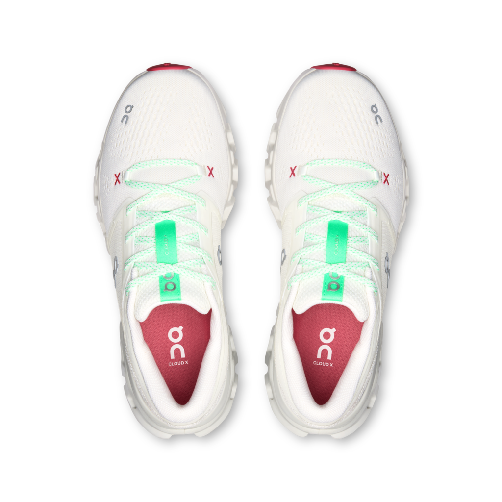 A pair of On Cloud running shoes shown from a top-down view, featuring a white mesh upper with mint green laces, red accents on the toe and heel, and a red interior lining with the On logo.