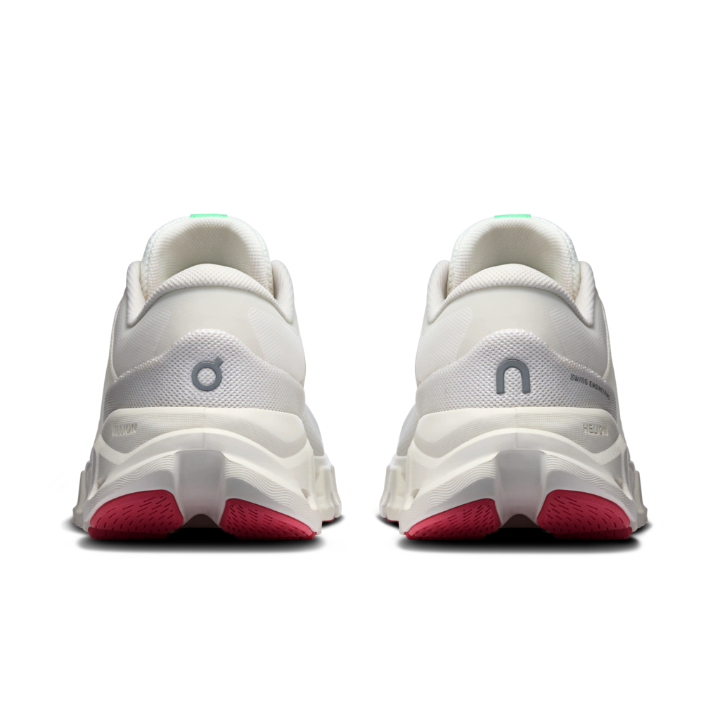 A pair of white On running shoes shown from the rear, featuring a chunky white midsole, a gray 'on' logo, and bright pink outsoles.