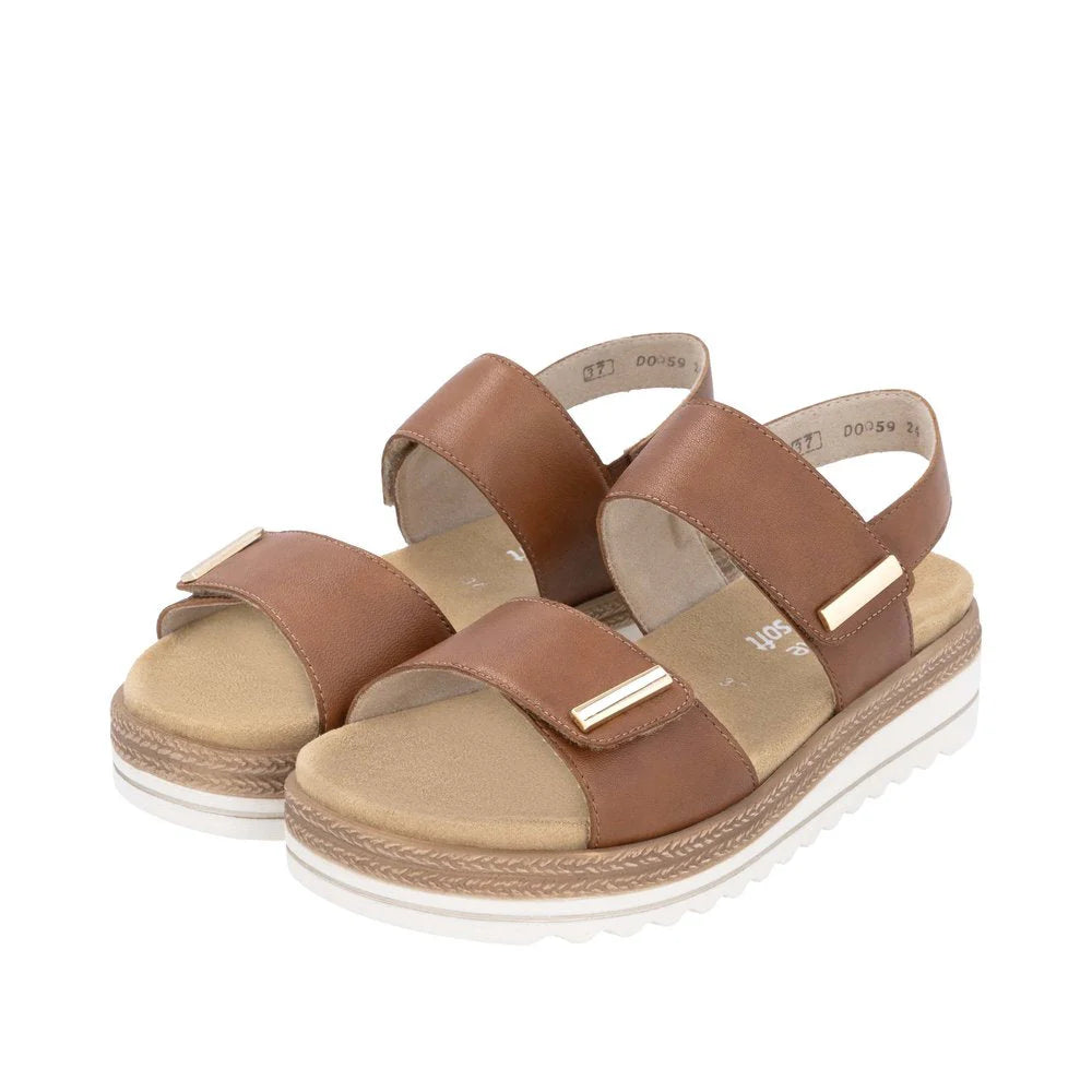 Pair of brown and beige sandals on a white background