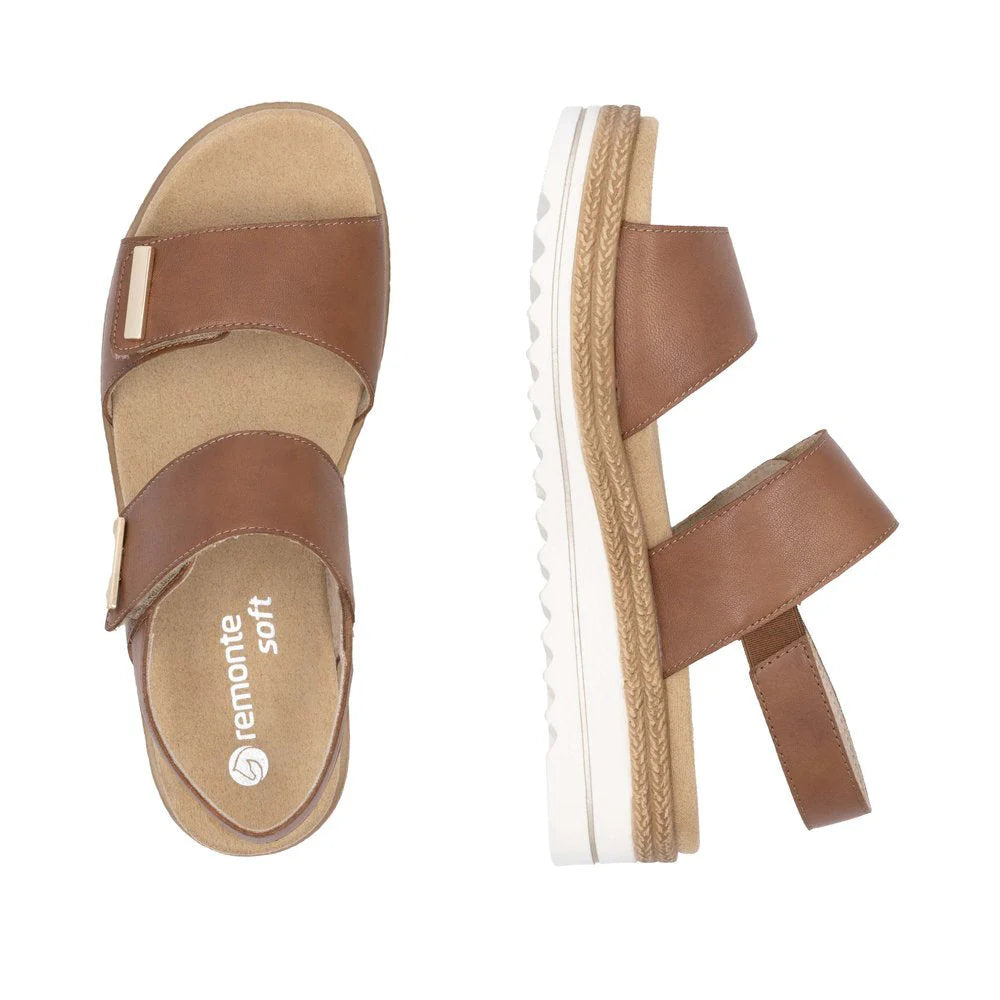 Brown sandal with white sole on a white background
