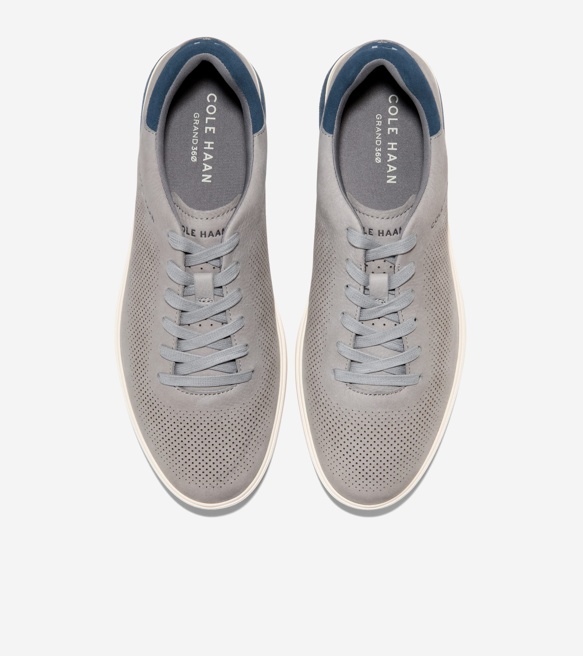Pair of Cole Haan sneakers on a white background