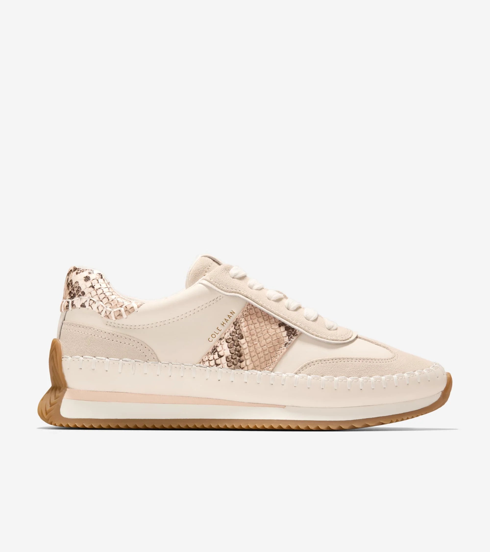Beige sneaker with rose gold accents on a white background