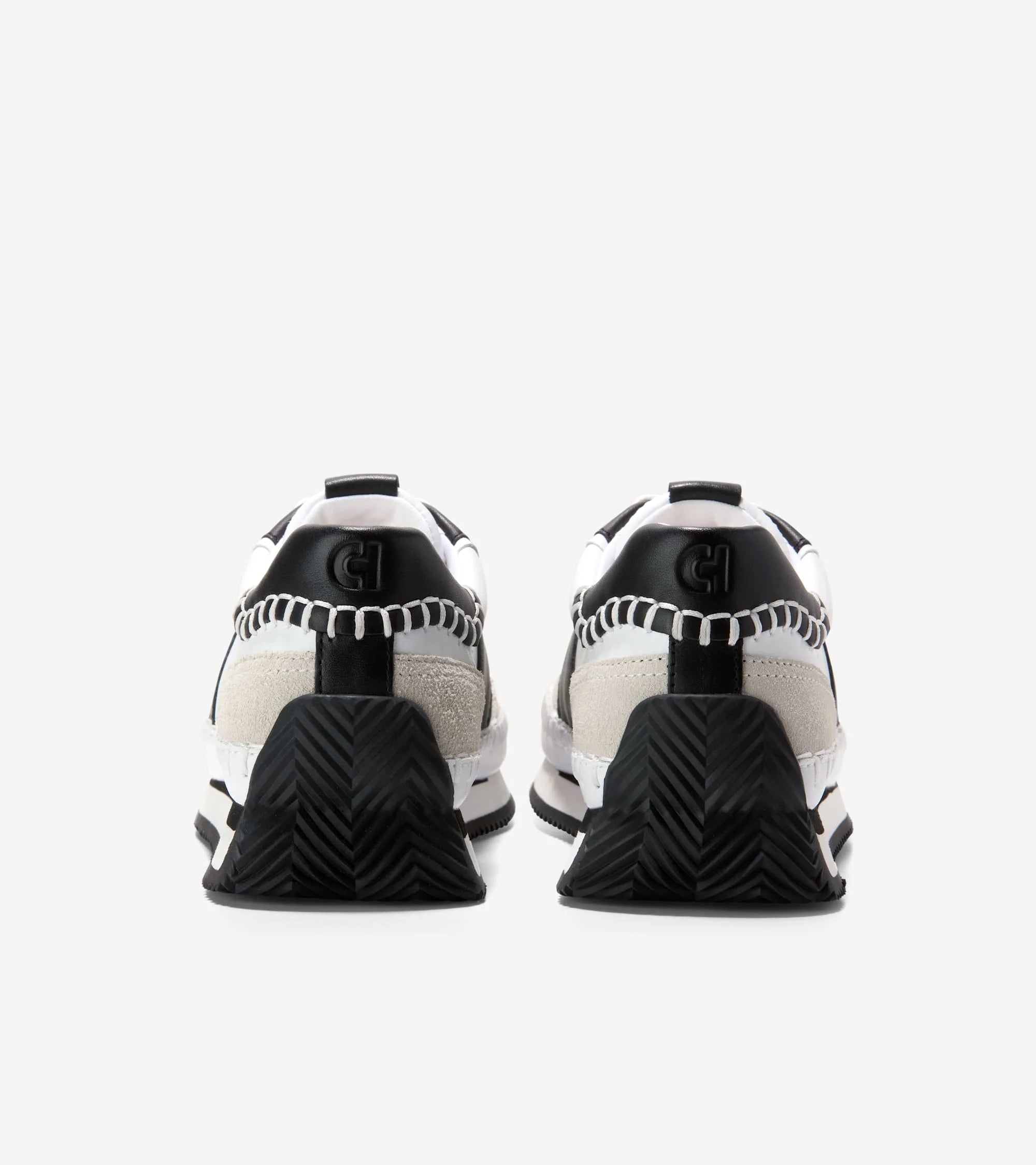Pair of black and white sneakers on a white background
