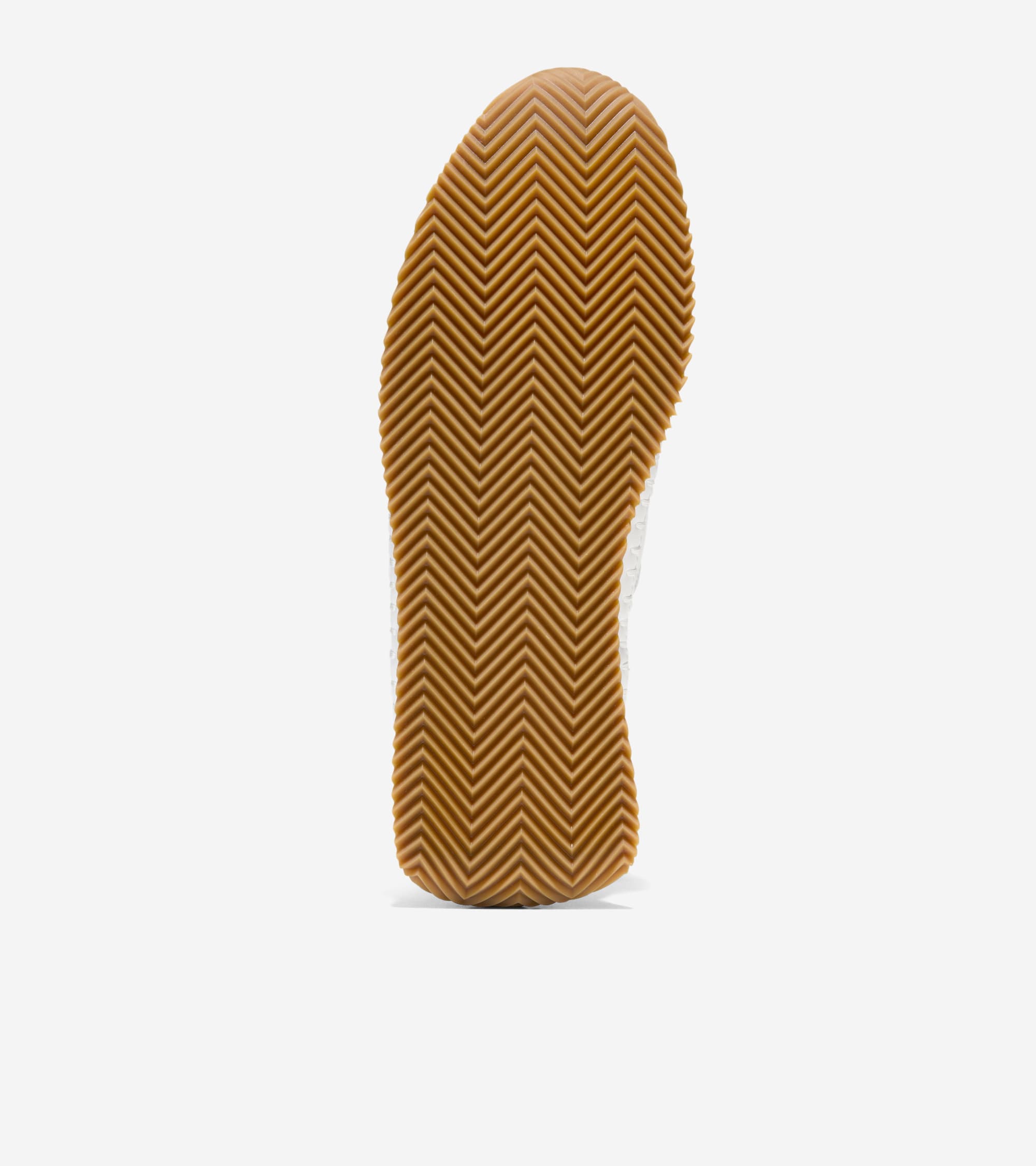 Close-up of a brown shoe sole on a white background